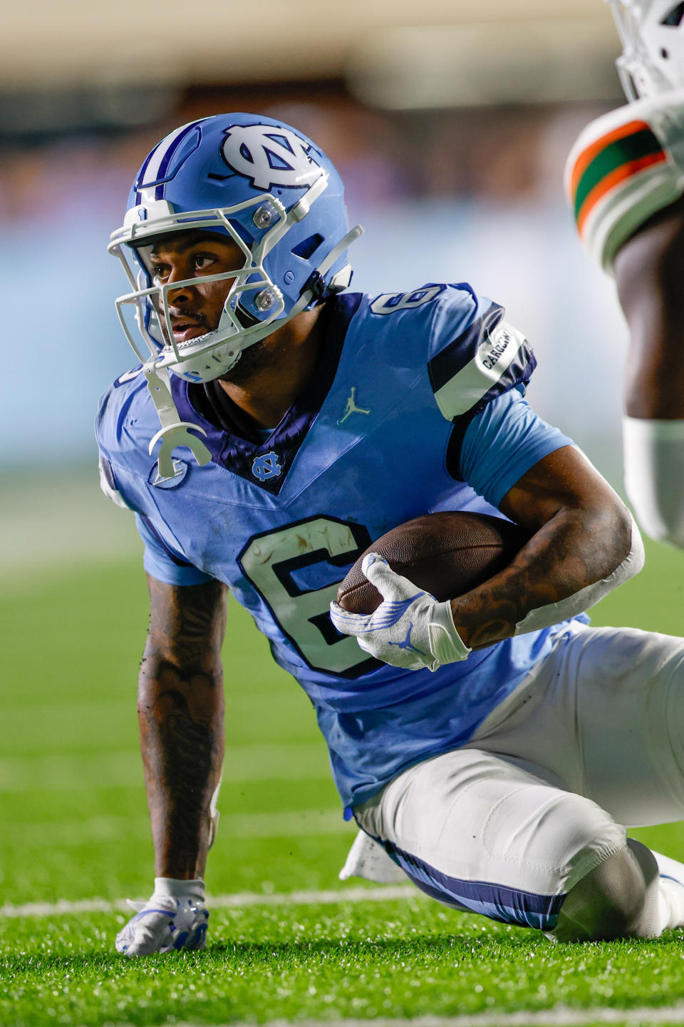 Oct 14, 2023; Chapel Hill, North Carolina, USA; North Carolina Tar Heels wide receiver Nate McCollum (6) after a run against the Miami Hurricanes in the second half at Kenan Memorial Stadium. Mandatory Credit: Nell Redmond-USA TODAY Sports