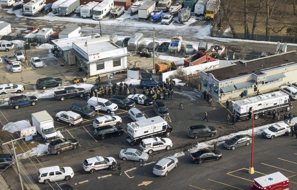 First responders and emergency vehicles are gathered near the scene of a shooting at an industrial park in Aurora on Friday. Source: Bev Horne/Daily Herald via AP