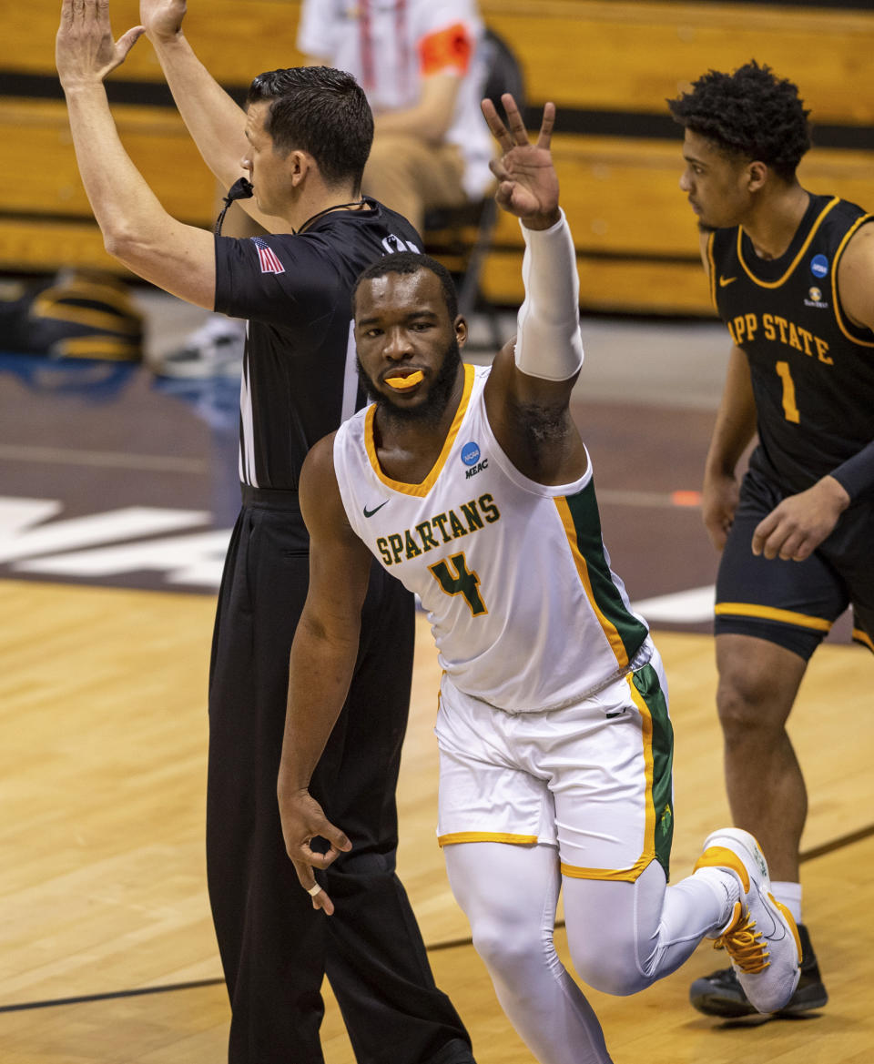 Norfolk State guard Joe Bryant Jr. (4) reacts after scoring a three-point basket during the first half of a First Four game against Appalachian State in the NCAA men's college basketball tournament, Thursday, March 18, 2021, in Bloomington, Ind. (AP Photo/Doug McSchooler)