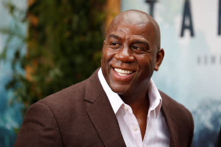 FILE PHOTO: Former NBA basketball player Earvin Magic Johnson poses at the premiere of the movie "The Legend of Tarzan" in Hollywood, California, June 27, 2016. REUTERS/Danny Moloshok