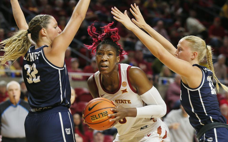 Iowa State center Isnelle Natabou (0) drives to the basket between a pair of Butler defenders during Monday's season-opening game at Hilton Coliseum in Ames.