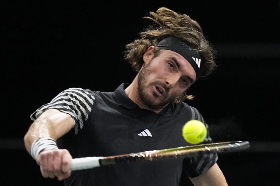 Greece's Stefanos Tsitsipas returns the ball to Germany's Alexander Zverev during their third round match of the Paris Masters tennis tournament, at the Accor Arena, Thursday Nov. 2, 2023 in Paris. (AP Photo/Michel Euler)