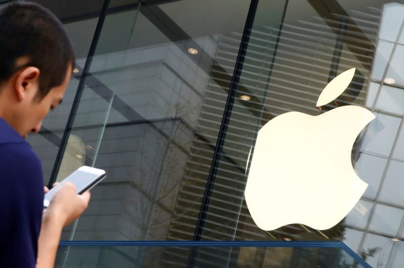 A man holds Apple smartphone outside an Apple store in Beijing, China, September 16, 2016. — Reuters pic