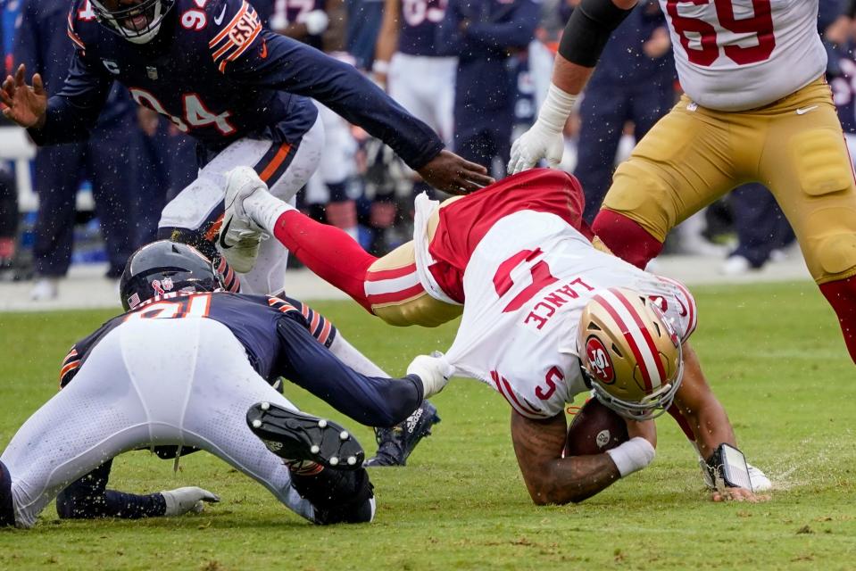 Chicago Bears' Dominique Robinson sacks San Francisco 49ers' Trey Lance during the first half of an NFL football game Sunday, Sept. 11, 2022, in Chicago. (AP Photo/Charles Rex Arbogast)