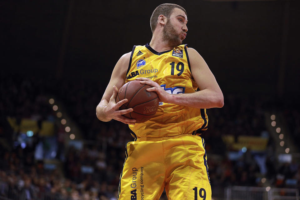 Albert Miralles pulls down a rebound for Alba Berlin during a February 2013 game in Munich, Germany. (Bongarts/Getty Images)