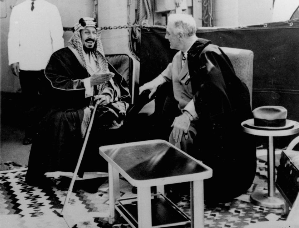 FILE - In this Feb. 14, 1945 file photo, U.S. President Franklin D. Roosevelt, right, and King Abdul Aziz Ibn Saud discuss Saudi-U.S. relations aboard USS Quincy in the Great Bitter Lake north of the city of Suez, Egypt. The kingdom of Saudi Arabia has enjoyed the ultimate protected status from the U.S. throughout its short history, from Roosevelt meeting Saudi Arabia’s first king on Valentine’s Day in 1945 to the kingdom becoming America’s main Mideast ally following the downfall of Iran’s shah in 1979. (AP Photo, File)