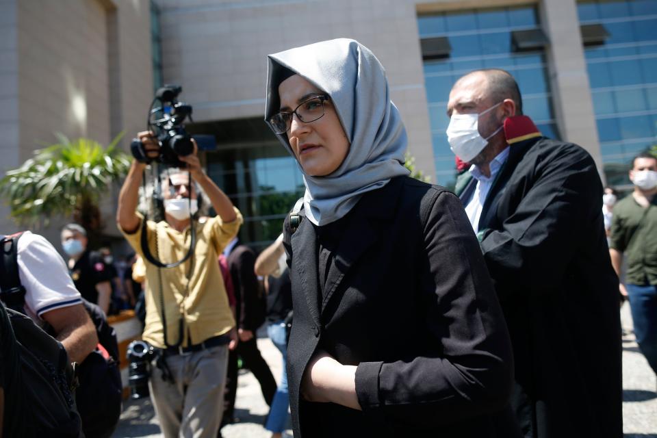Ms Cengiz outside the court in Istanbul after the trial's opening (AP)