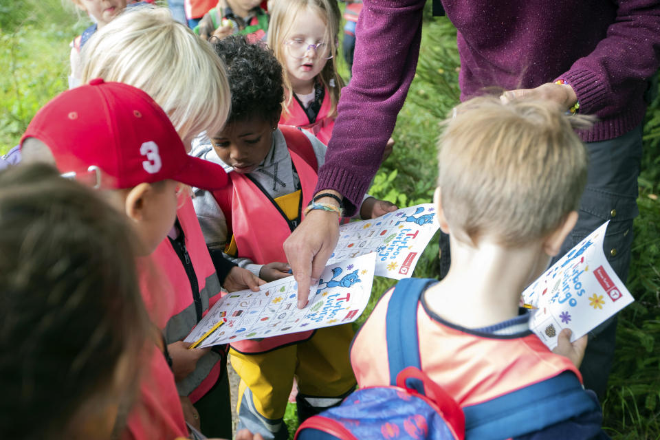 Children take part in a hike offered through the Norwegian Tourism Association in Brekkeskogen, Norway, Wednesday, Aug. 30, 2023. As many as 11,000 pre-school kids started their day this week hiking routes around kindergartens in Norway. “We hope we can inspire the kids to be outdoor children”, said Kristin Oftedal of the Norwegian Trekking Association, a volunteer organization which aims to promote outdoor activities. “We believe outdoor children are happy children”. (Emilie Holtet/NTB via AP)