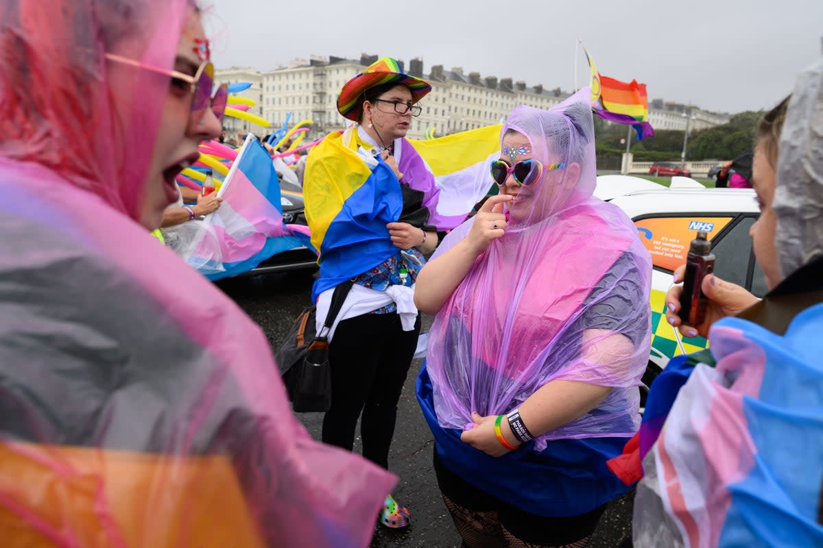 Revellers brave the heavy rain and strong winds during Brighton & Hove Pride 2023 (Getty)