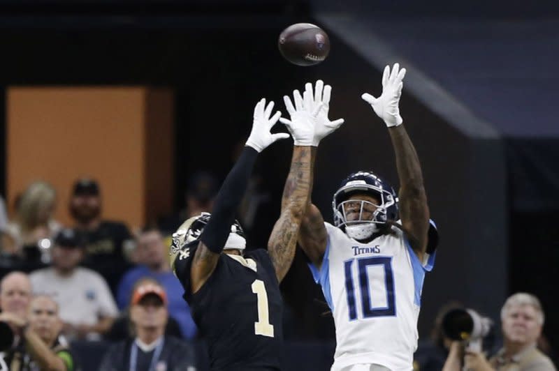 New Orleans Saints cornerback Alontae Taylor (L) knocks the ball away from Tennessee Titans wide receiver DeAndre Hopkins on Sunday at the Caesars Superdome in New Orleans. Photo by AJ Sisco/UPI