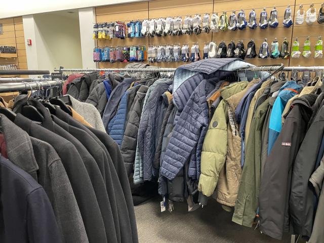 Men's clothing is displayed for sale inside a Nordstrom Rack store