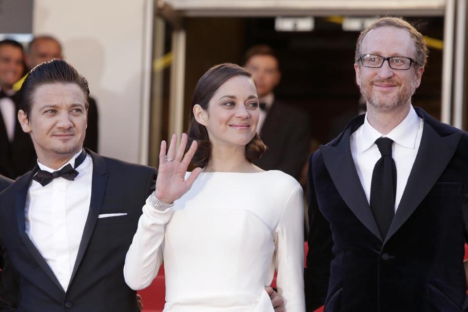 From left, actors Jeremy tenner, Marion Cotillard and director James Gray arrive for the screening of the film The Immigrant at the 66th international film festival, in Cannes, southern France, Friday, May 24, 2013. (Photo by Joel Ryan/Invision/AP)