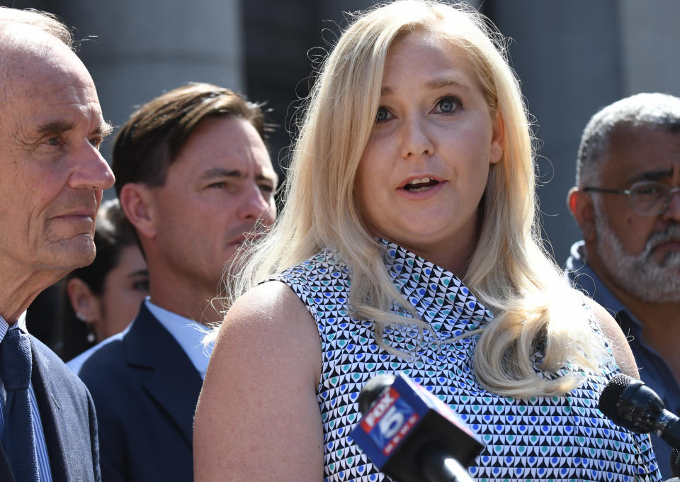 Joined by attorneys David Boies, left, and Brad Edwards, alleged Jeffrey Epstein victim Virginia Guiffre speaks to the media outside federal court in Manhattan, New York on August 27, 2019. Epstein, a convicted pedophile, killed himself in prison earlier in the month while awaiting trial on charges of conspiracy and trafficking minors for sex. Photo by Louis Lanzano /Sipa USA