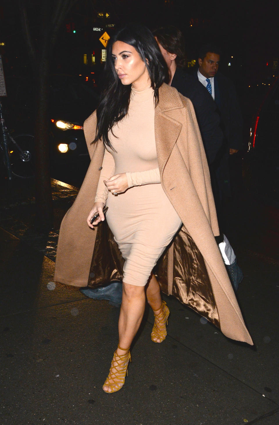 Sporting a Max Mara coat and a $19 dress, Mrs. West looked ulter chic on the streets on New York City.