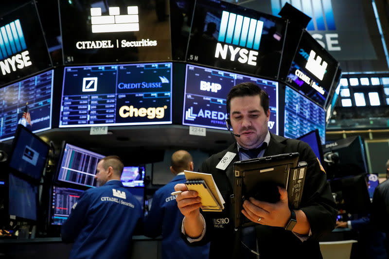 Traders work on the floor of the New York Stock Exchange (NYSE) in New York, U.S., August 22, 2017. REUTERS/Brendan McDermid
