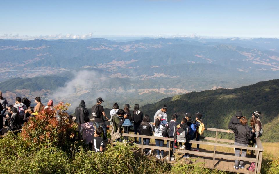 Tourists enjoying the views on the Kew Mae Pan Nature Trail in Thailand's Doi Inthanon National Park