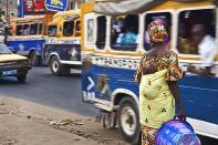 Dakar, Senegal. <br><br>Woman and child wait to cross busy street. <br><br>Camera: Canon 40D Edgard de Bono, Italy <br><br>Winner, New Talent portfolio. Diary of a Destination