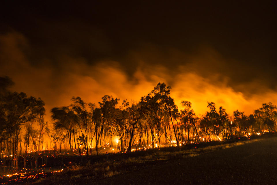 The orange glow of this night view of a bushfire in the Northern Territory of Australia hints at the raw energy of the inferno.