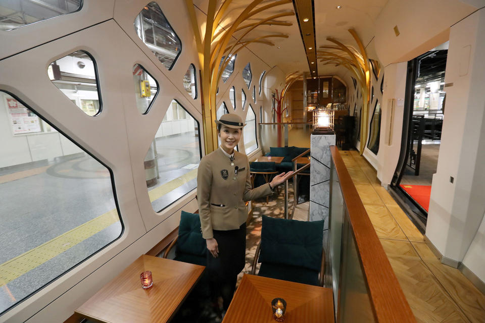 Crew member shows lounge car