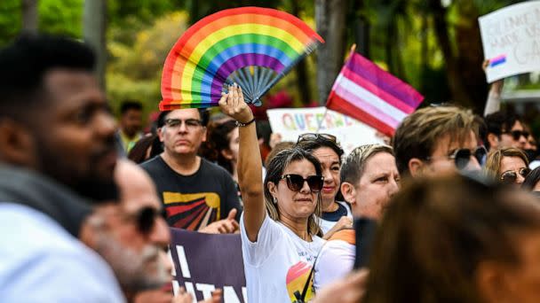 PHOTO:  Members and supporters of the LGBTQ community attend the 'Say Gay Anyway' rally in Miami, March 13, 2022. Florida's state senate passed a bill banning lessons on sexual orientation and gender identity in elementary schools. (Chandan Khanna/AFP via Getty Images)