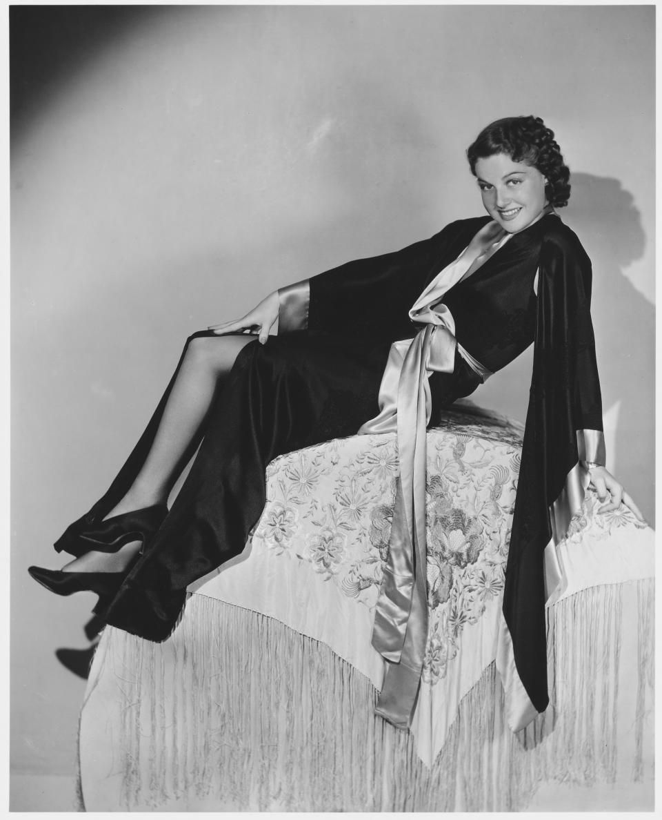 Sheridan poses in a black silk robe in this undated photo.&nbsp;