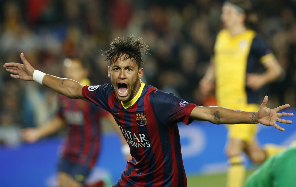 Barcelona's Neymar celebrates after scoring his sides first goal during a first leg quarterfinal Champions League soccer match between Barcelona and Atletico Madrid at the Camp Nou stadium in Barcelona, Spain, Tuesday April 1, 2014. (AP Photo/Emilio Morenatti)