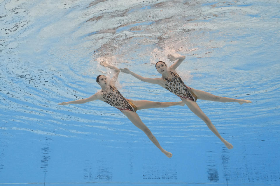 Wang Liuyi and Wang Qianyi, of China, compete in the women's duet free final of artistic swimming at the World Aquatics Championships in Doha, Qatar, Thursday, Feb. 8, 2024. (AP Photo/Lee Jin-man)