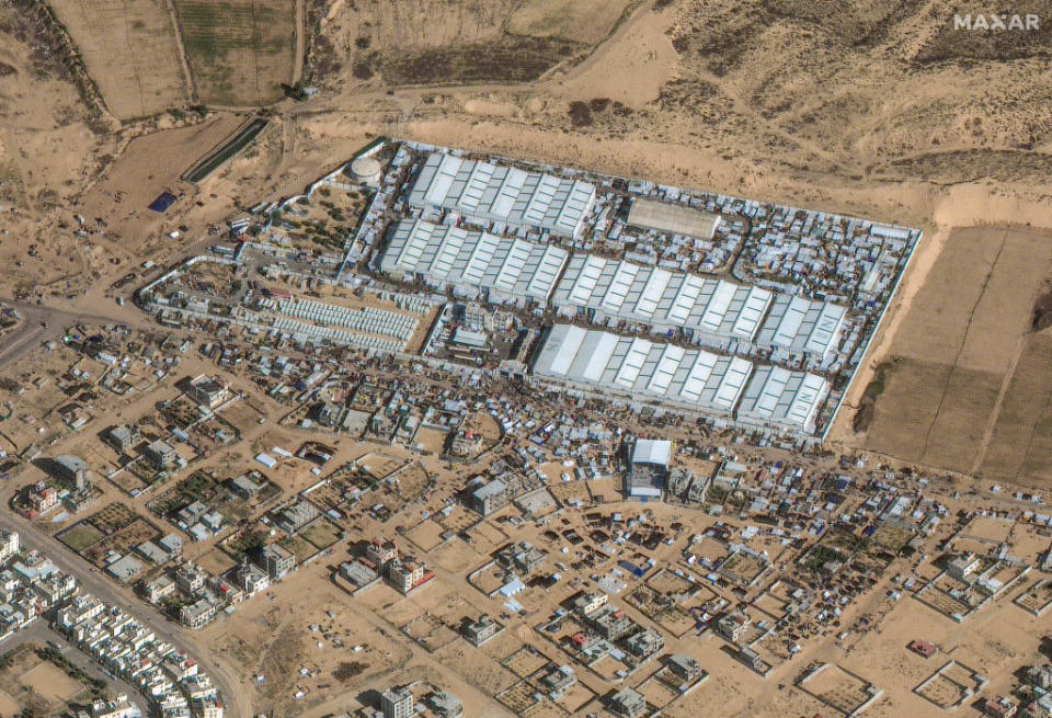 Maxar satellite imagery of crowds and shelters at a U.N. aid center in Rafah on Dec. 3, 2023. <span class="copyright">2023 Maxar Technologies—Getty Images</span>