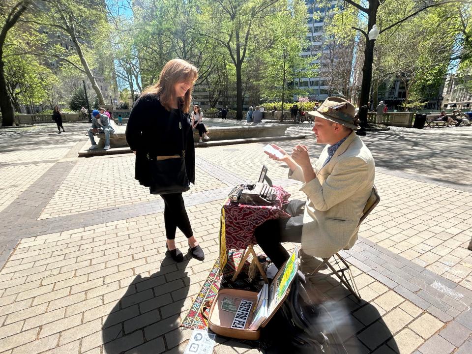 Marshall Kavanaugh reads a poem he wrote for Michelle Chapman's son, who's turning 17. Kavanaugh writes for tips, producing poetry on demand in public places.