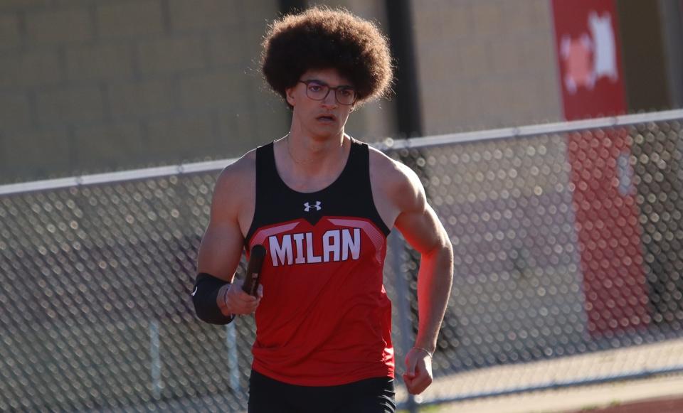 Virgile Gruwez-Guinet runs for Milan during a meet against St. Mary Catholic Central on Tuesday, April 30, 2024.
