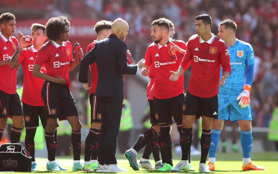 Manchester United manager Erik ten Hag chats with Cristiano Ronaldo - Cristiano Ronaldo offered peace deal by manager Erik ten Hag - GETTY IMAGES 