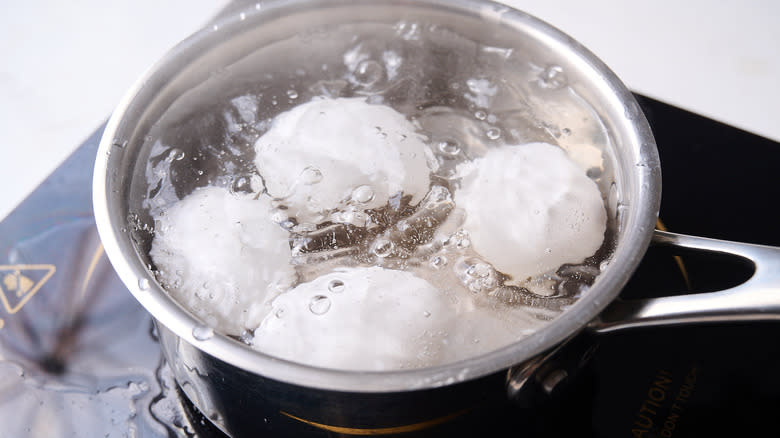 boiling eggs in pot