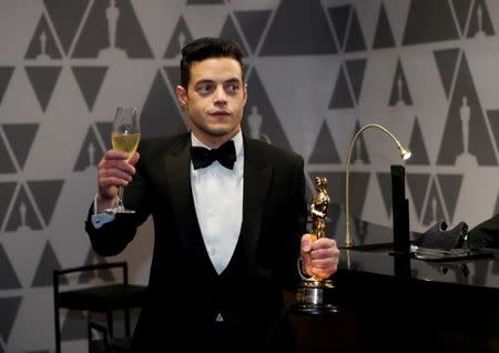 91st Academy Awards - Oscars Governors Ball - Hollywood, Los Angeles, California, U.S., February 24, 2019. Rami Malek winner of the Best Actor award for "Bohemian Rhapsody" holds his Oscar after getting it engraved. Picture taken February 24, 2019. REUTERS/Mario Anzuoni/Files