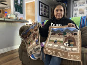 Seraphine Warren poses for a photo in her home in Tooele, Utah, on Sept. 23, 2021, with a rug made by her aunt, Navajo rug weaver Ella Mae Begay. Begay, 62, disappeared in June, one of thousands of missing Indigenous women across the U.S. The extensive coverage of the Gabby Petito case is renewing calls to also shine a spotlight on missing people of color. (AP Photo/Lindsay Whitehurst)