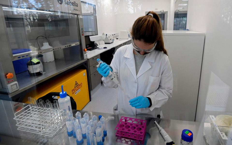 A scientist works at the mAbxience biosimilar monoclonal antibody laboratory plant in Garin, Buenos Aires province, where an experimental vaccine against Covid-19 developed by the University of Oxford and the AstraZeneca laboratory will be produced for Latin America - JUAN MABROMATA /AFP