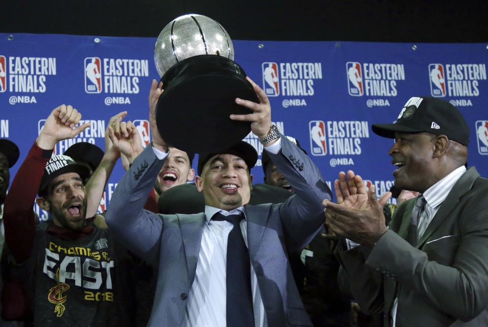 FILE - In this May 27, 2018, file photo, Cleveland Cavaliers head coach Tyronn Lue hoists the trophy after beating the Boston Celtics 87-79 in Game 7 of the NBA basketball Eastern Conference finals, in Boston. Tyronn Lue has agreed in principle to become the next coach of the Los Angeles Clippers. Final terms were still being worked on, according to the person who spoke to The Associated Press on condition of anonymity Thursday, Oct. 15, 2020, because no contract had been signed. (AP Photo/Elise Amendola, File)