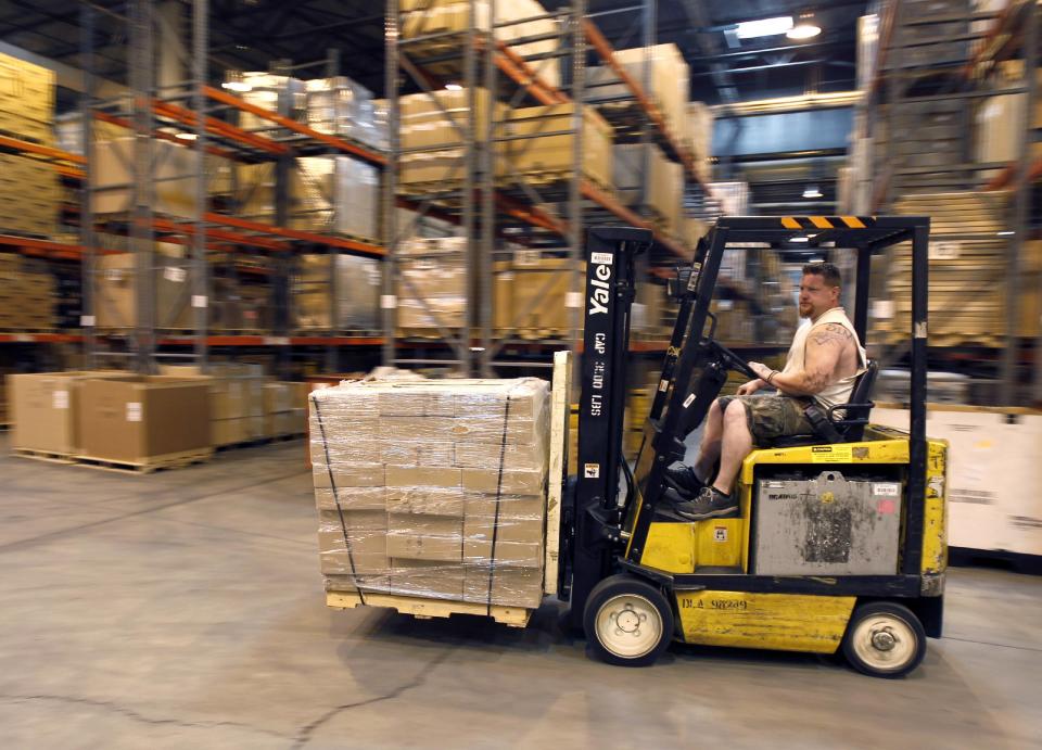 Forklift driver handles a load at the Defense Logistics Agency's giant storage facility outside Harrisburg, Pennsylvania