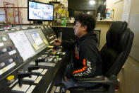 A worker sits in a mining winch operations room at the Energy Fuels Inc. uranium Pinyon Plain Mine Wednesday, Jan. 31, 2024, near Tusayan, Ariz. The largest uranium producer in the United States is ramping up work just south of Grand Canyon National Park on a long-contested project that largely has sat dormant since the 1980s. (AP Photo/Ross D. Franklin)