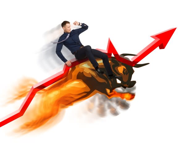 Man riding bull along a red arrow pointing up