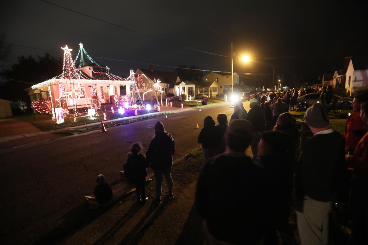 A large crowd gathered to watch the opening night of the Lemmon brothers' Christmas light show on Saturday. Brothers Auston and Brandon have had the display for five years at their home on Lindbergh Avenue in Zanesville.