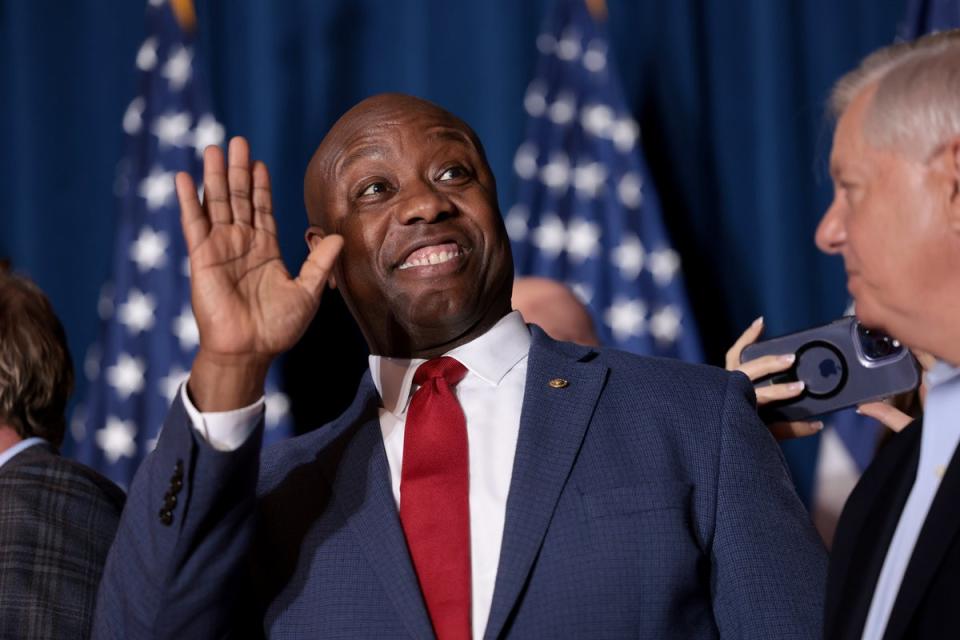 Tim Scott cheers on Donald Trump as he speaks during an election night watch party in Columbia, South Carolina (Getty Images)