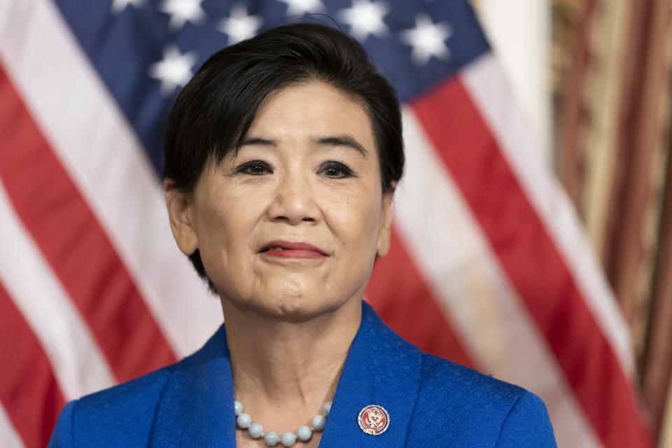 FILE- Rep. Judy Chu, D-Calif., stands before House Speaker Nancy Pelosi of Calif., signs H.R. 3525, the Commission to Study the Potential Creation of a National Museum of Asian Pacific American History and Culture Act during a ceremony on Capitol Hill, June 7, 2022, in Washington. The leaders of a new House select committee on China defended Democratic Rep. Judy Chu on Sunday, Feb. 26, 2023, saying it was abhorrent and unacceptable for a GOP lawmaker to question her loyalty to the United States based on her Chinese heritage. (AP Photo/Alex Brandon, File)