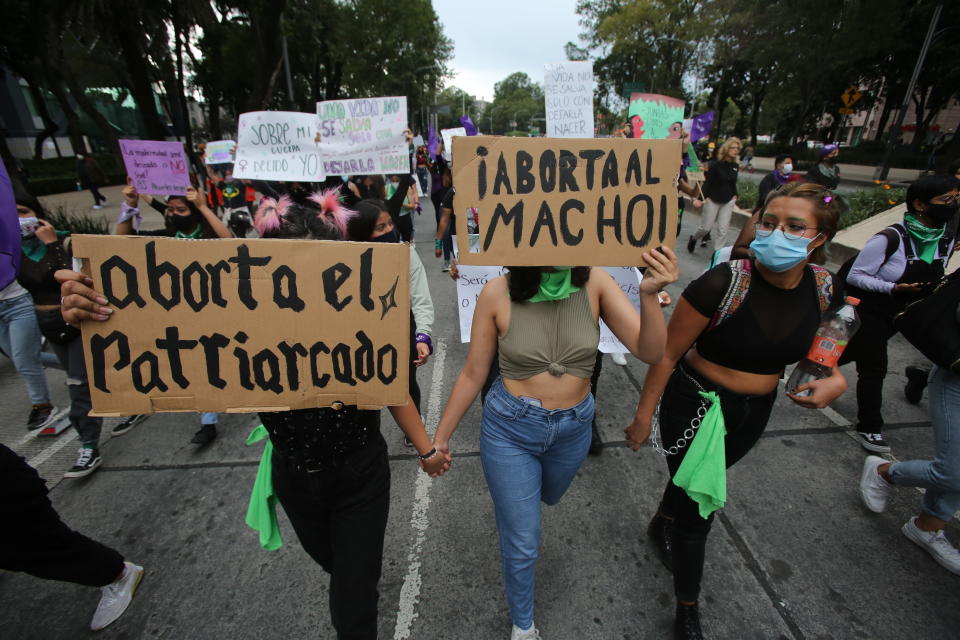 Women march in an abortion-rights demonstrators during the Day for Decriminalization of Abortion, in Mexico City, Tuesday, Sept. 28, 2021. (AP Photo/Ginnette Riquelme)