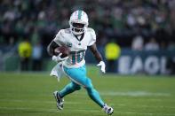 Miami Dolphins wide receiver Tyreek Hill (10) runs with the ball during the second half of an NFL football game against the Philadelphia Eagles on Sunday, Oct. 22, 2023, in Philadelphia. (AP Photo/Matt Rourke)