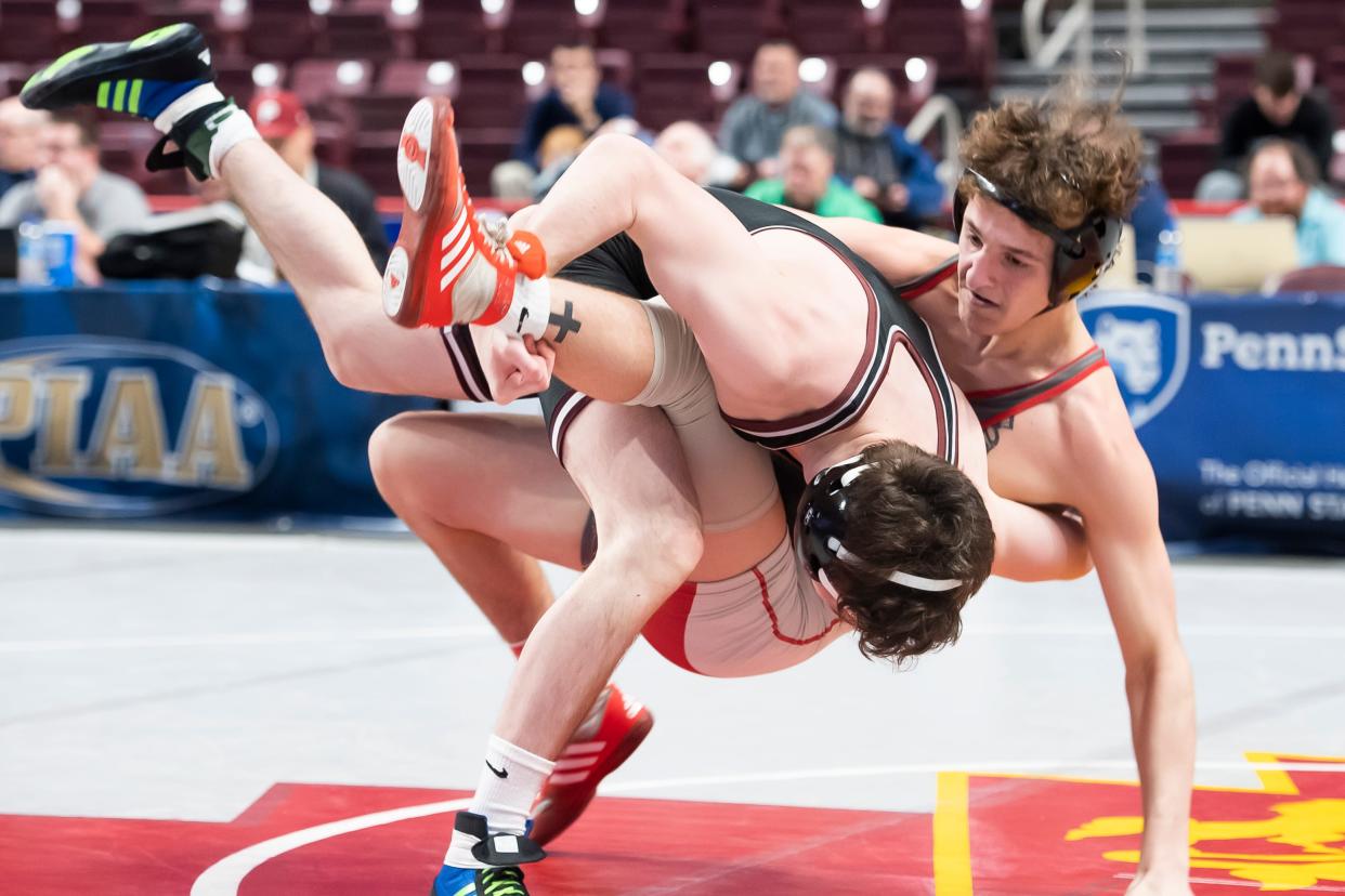 West Allegheny's Ty Watters gets taken down to the mat by Abington's Shane Kibler during a 145-pound round of 16 bout at the PIAA Class 3A Wrestling Championships at the Giant Center on Thursday, March 10, 2022, in Derry Township. Watters won by fall at 1:32.