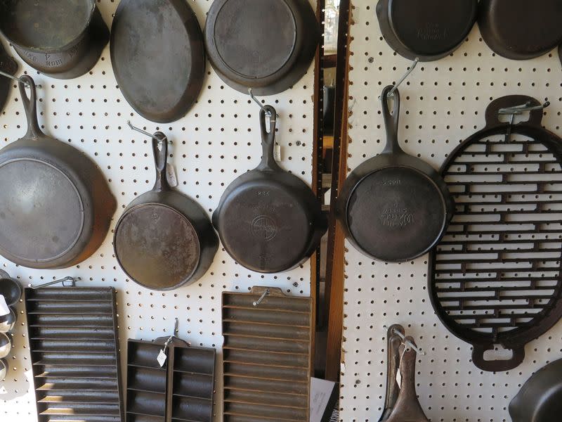A bunch of lovely vintage cast iron at a flea market.