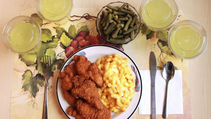 This undated photo from the National Institutes of Health in June 2019 shows an “ultra-processed” lunch including brand-name macaroni and cheese, chicken tenders, canned green beans and diet lemonade.