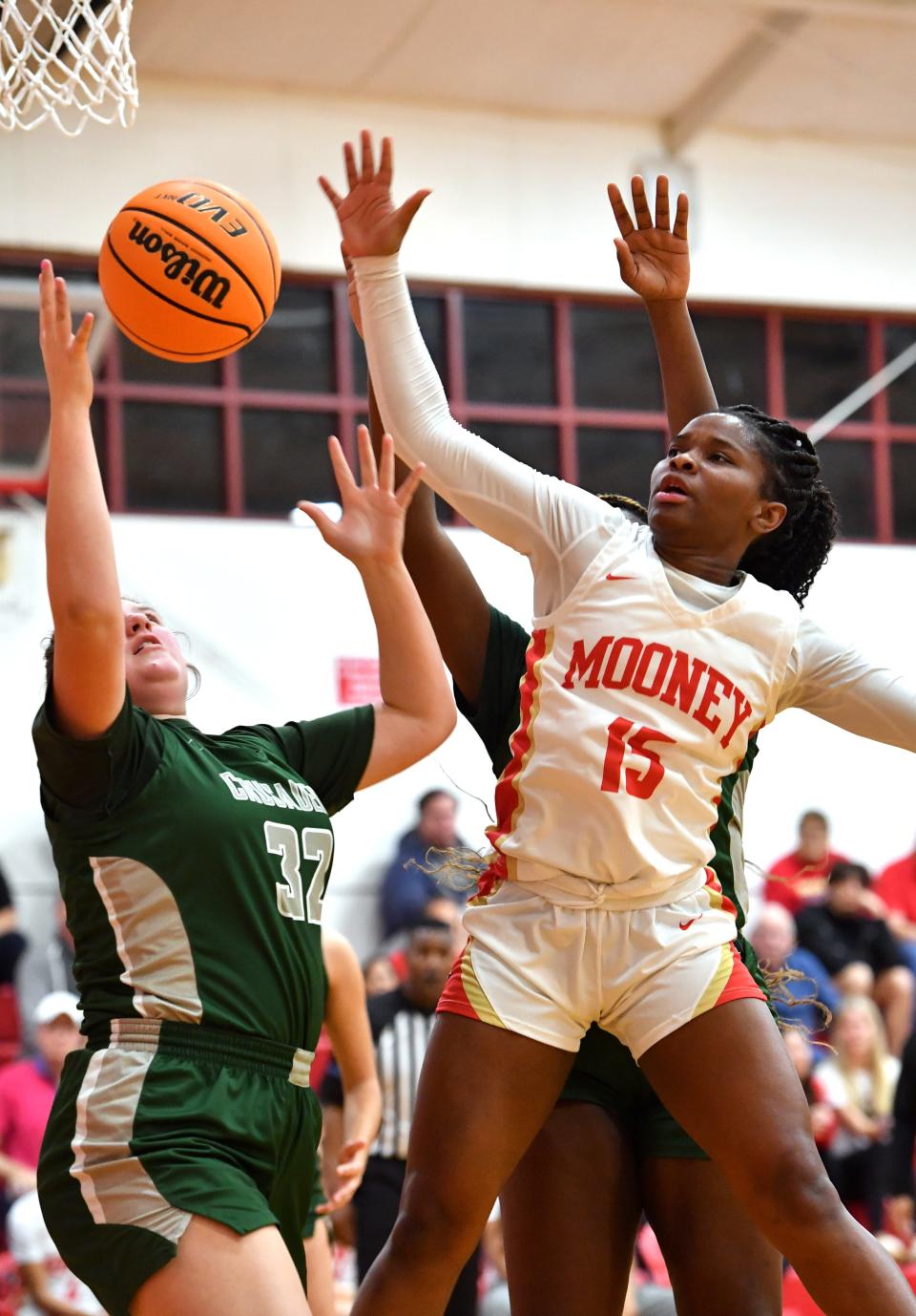 Mooney's Sy'monique Simon (#15) goes up for a rebound. Cardinal Mooney hosted Tampa Catholic in the girls basketball regional semi-final on Tuesday night. 