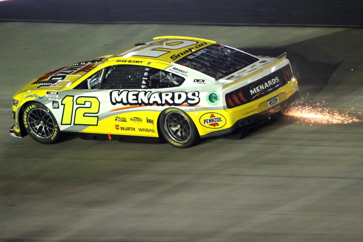 BRISTOL, TN - SEPTEMBER 17: Ryan Blaney (#12 Team Penske Menards\Pennzoil Ford) leaves a trail of sparks into turn 3 during the running of the NASCAR Cup Series Playoff Bass Pro Shops  Night Race on September 17, 2022 at Bristol Motor Speedway in Bristol, TN. (Photo by Jeff Robinson/Icon Sportswire via Getty Images)