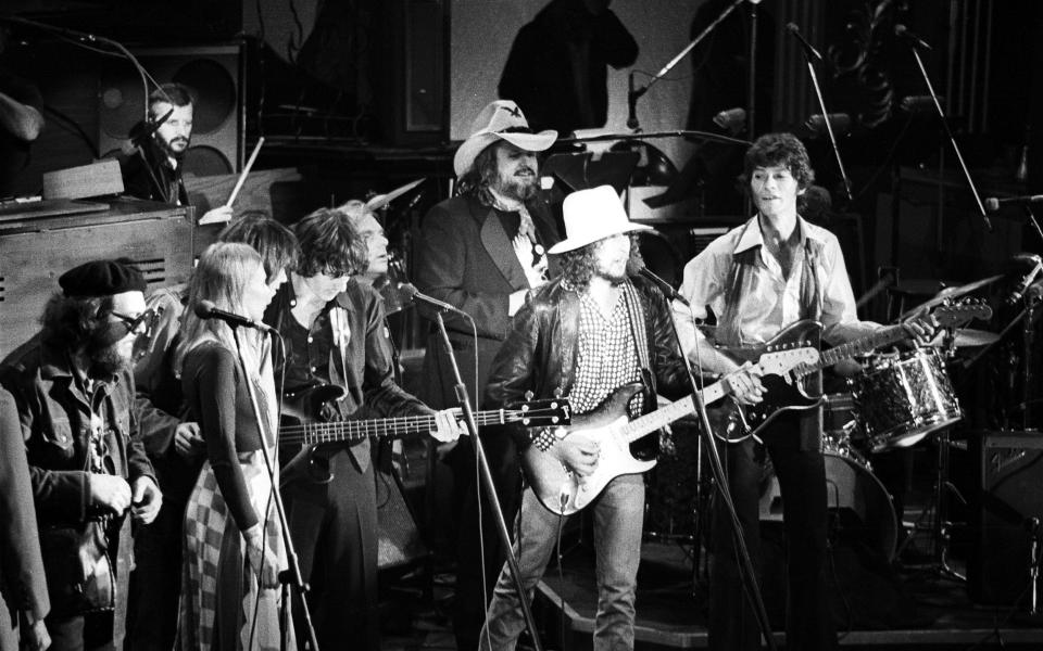 Bob Dylan joins the Band at their 'Last Waltz' at Winterland, San Francisco, in 1976, l-r, Dr John, Joni Mitchell, Neil Young, Ringo Starr, Rick Danko, Van Morrison, Hawkins, Dylan and Robbie Robertson - Ed Perlstein/Redferns/Getty Images